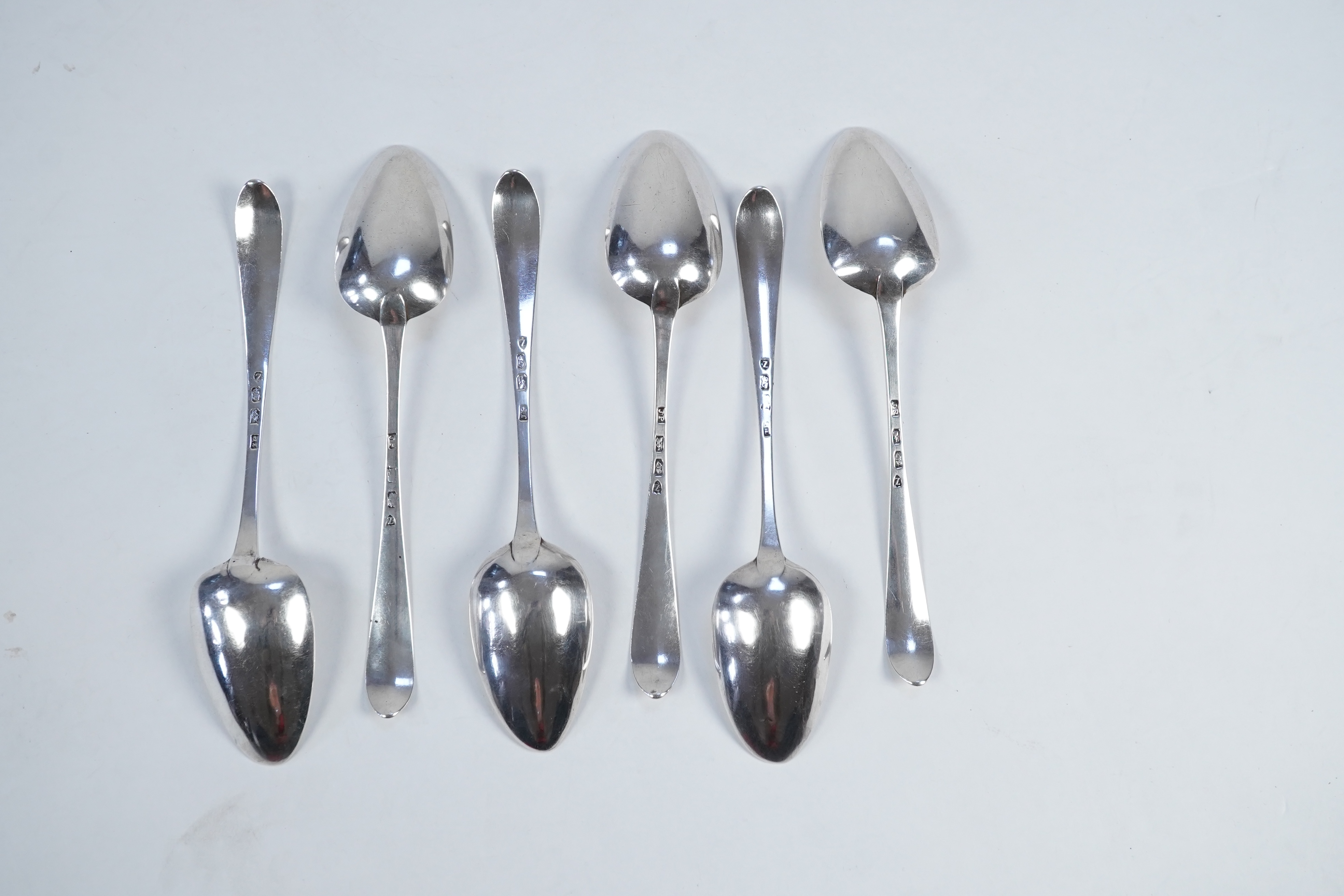 A set of six George III Irish silver bright cut engraved serving/table spoons by John Pittar